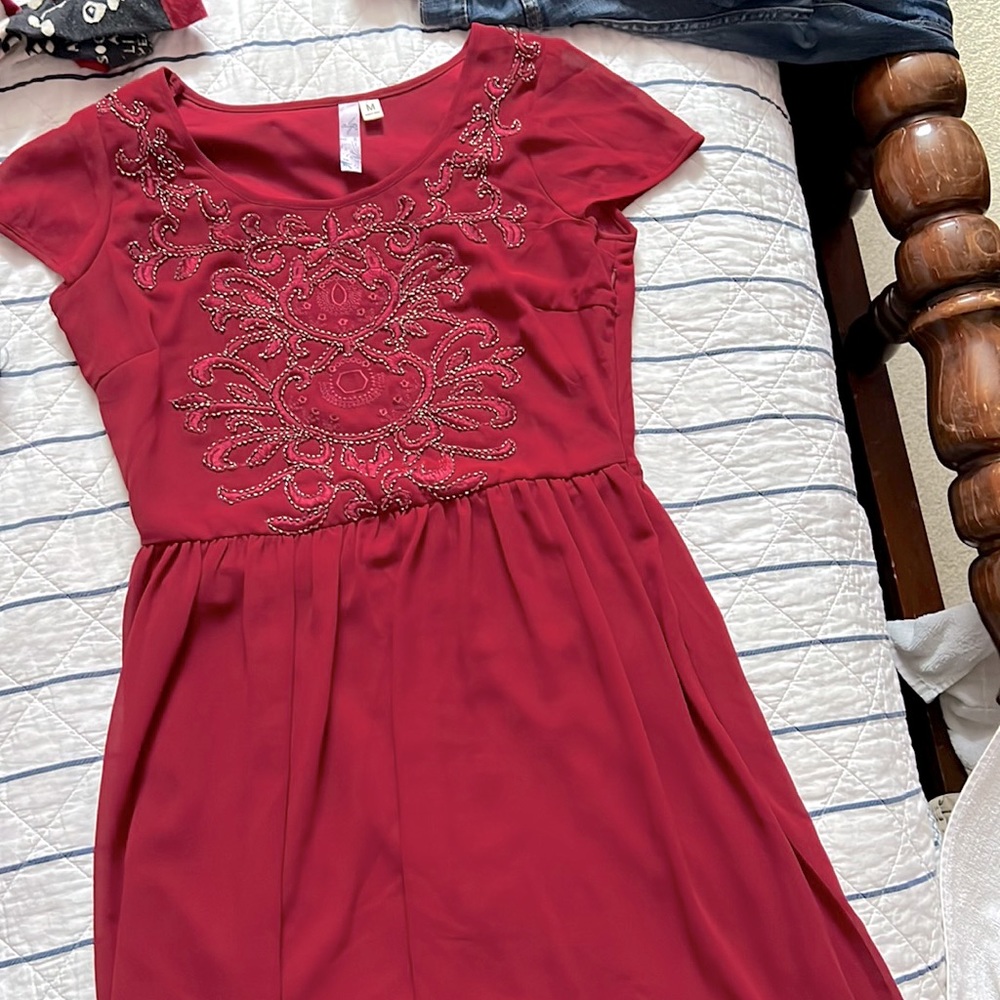 Francesca’s red knee length dress